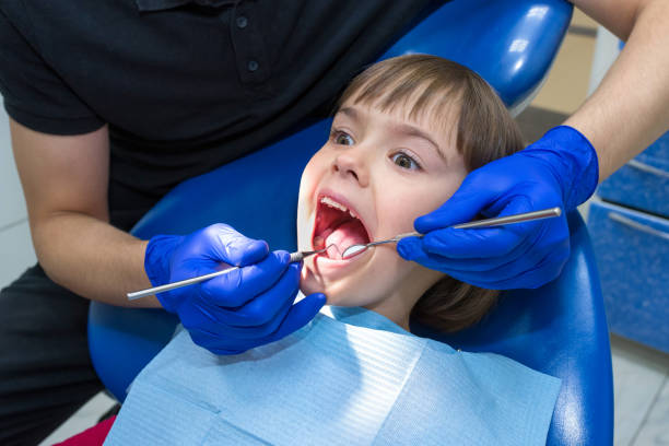 istock A dentist examining a patient’s teeth in the dentistry. 1188018617