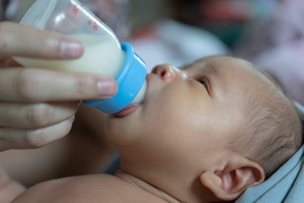 istock Newborn babies are drinking milk from bottles. 1188022205