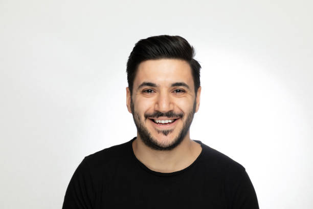 istock Laughing  handsome young man over isolated  gray background 1188024804