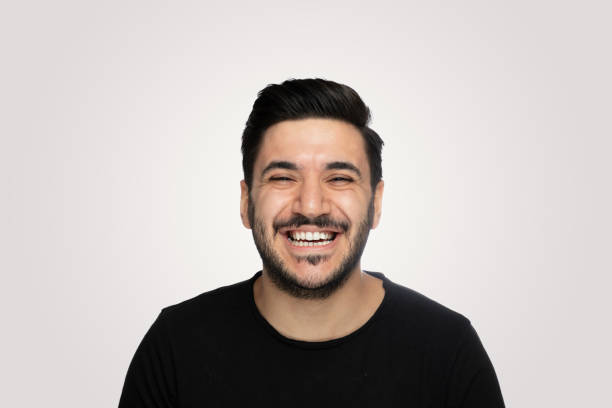 istock Laughing young man over isolated  gray background 1188024836
