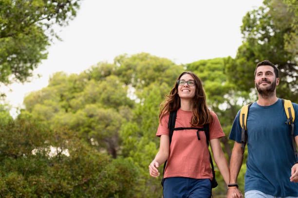 istock Smiling young Spanish couple enjoying weekend day hike 1188026037