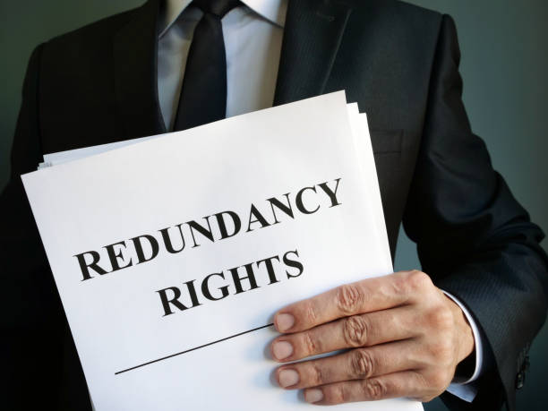 istock Man is holding Redundancy rights law. 1188027169