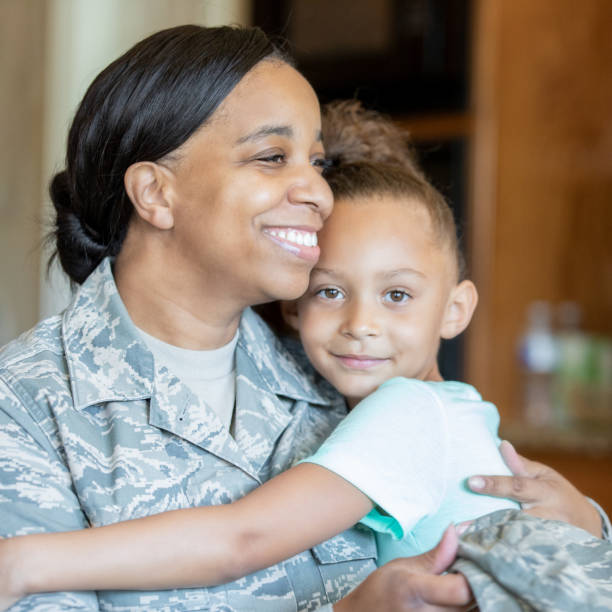 istock Soldier mom embraces daughter 1188030040