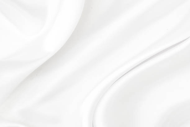 istock White gray satin texture that is white silver fabric silk background with beautiful soft blur pattern natural. 1188030508