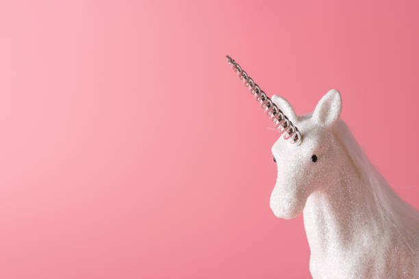 istock Creative composition with glitter unicorn on pink background. Minimal holiday concept. 1188031818