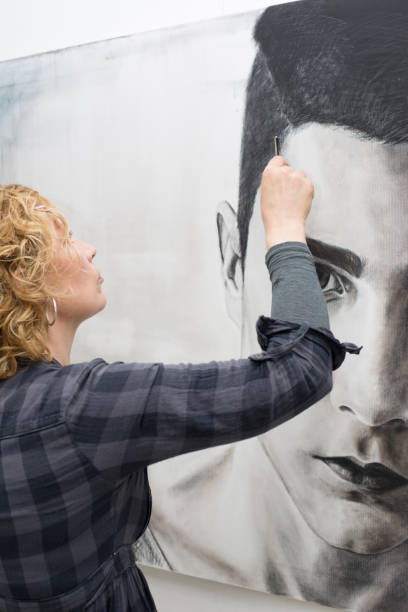 istock Female painter painting portrait 1188032732