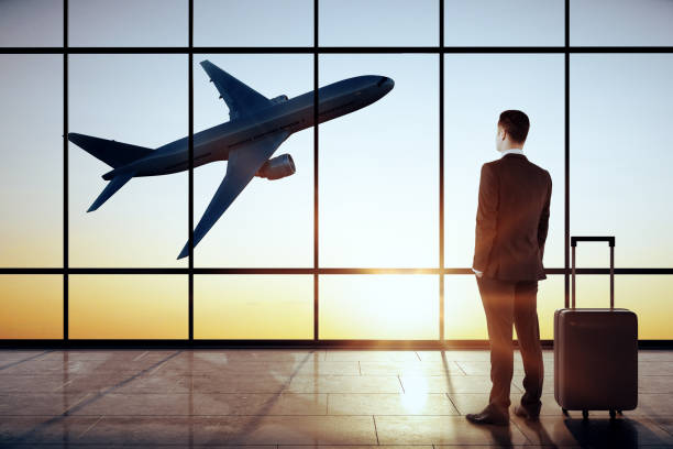 istock Businessman in modern airport interior 1188032929