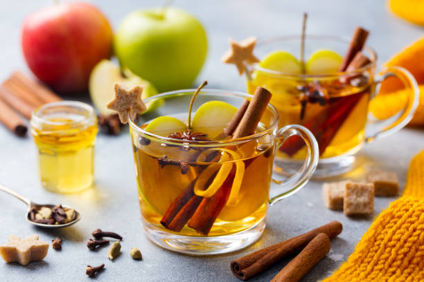 istock Apple mulled cider with spices in glass cup. Grey background. Close up. 1188035181