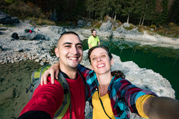 istock Smiling Friends Taking a Selfie on Hiking Trip 1188035770