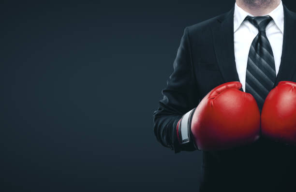 istock Businessman in red boxing gloves 1188036094