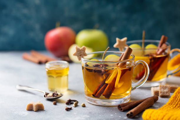 istock Apple mulled cider with spices in glass cup. Grey stone background. Copy space. 1188037370