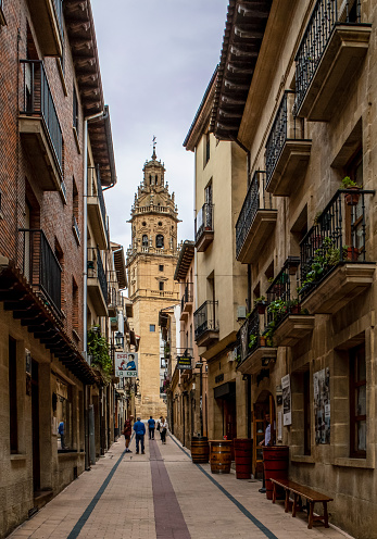 Haro, Spain - September 23, 2019: Picturesque narrow street with the view of Parroquia de Santo Tomás (Parish Church of St. Thomas the Apostle) in Haro, Spain