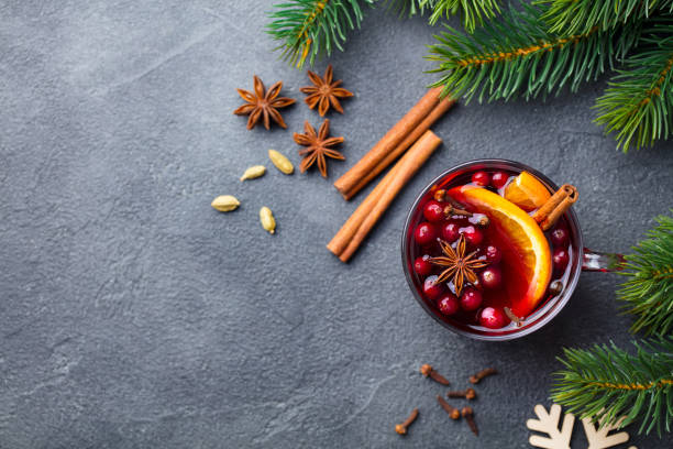 istock Mulled red wine with spices. Christmas decoration. Grey background. Copy space. Top view. 1188038323
