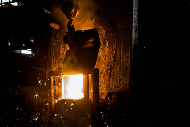 istock metal casting process with red high temperature fire in metal part factory 1188038641