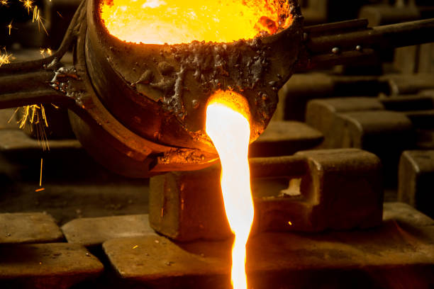istock metal casting process with red high temperature fire in metal part factory 1188038643