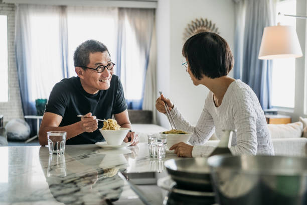istock Chinese couple eating lunch and talking 1188040488
