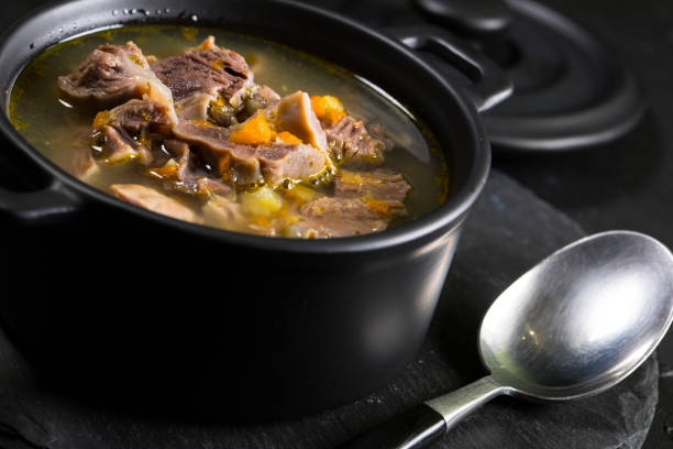 istock Chicken gizzards stewed with carrot in sauce. 1188041077