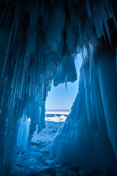 istock View from an ice cave with huge blue icicles on Lake Baikal. 1188041643