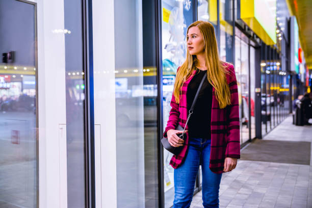 istock Women looking at store window 1188041790