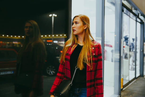 istock Women looking at store window 1188041794