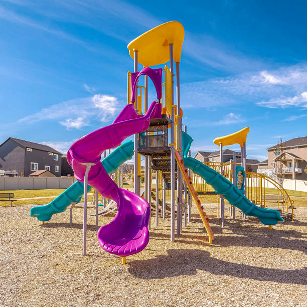 istock Square Brightly colored purple and blue slides during day 1188044676
