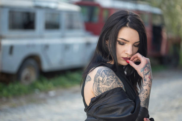 istock Young woman with tattoos 1188049106