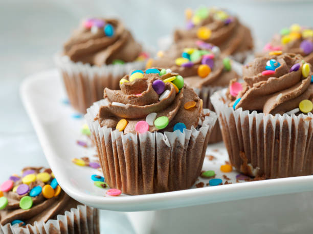 istock Colorful Cupcakes with Candy Sprinkles 1188056877