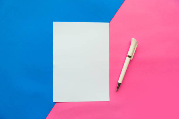 istock White mockup blank and pen on geometric pink and blue background. Flat lay, top view, copy space 1188059280