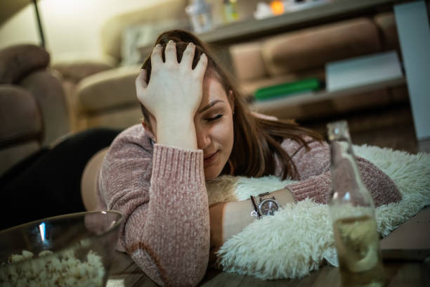 istock Drunk woman lying on the floor 1188062147