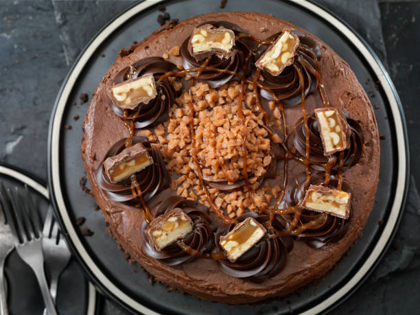 istock Caramel, Butter Toffee Crunch Chocolate Cake with Candy Bar Pieces 1188062206