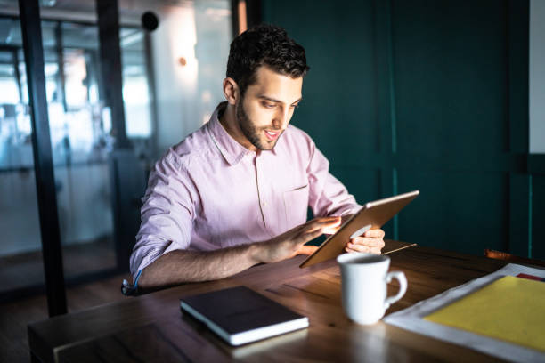 istock Businessman using digital tablet in his desk 1188064372