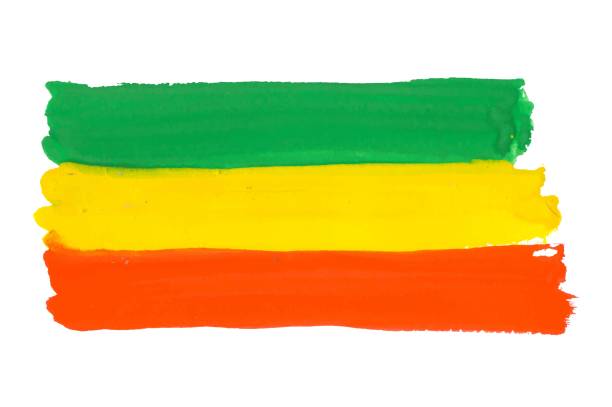 Rastafarian and Ethiopian flag drawn by paint on white, vector background with tricolor - red, yellow and green colors. Cannabis legalization and hippie lifestyle symbol concept. Colorful Rastafarian flag vector background reggae stock illustrations