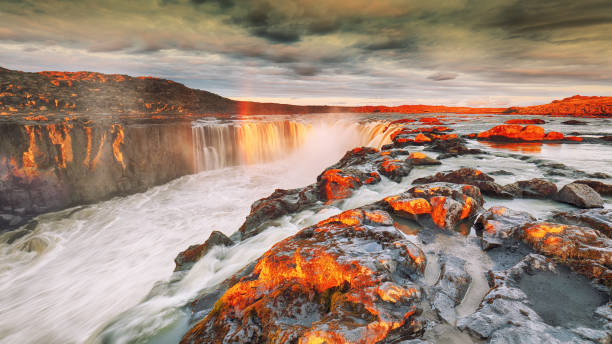 istock Dramatic sunset view  of waterfall in Iceland 1188071195