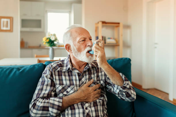 istock Senior Man Inhaling Asthmatic Cure 1188071234