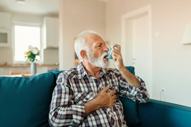 istock Senior Man Inhaling Asthmatic Cure 1188071250