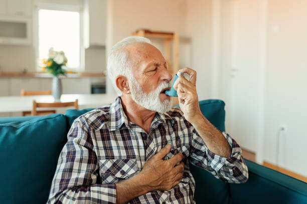 istock Senior Man Inhaling Asthmatic Cure 1188071252