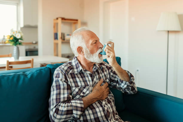 istock Senior Man Inhaling Asthmatic Cure 1188071275