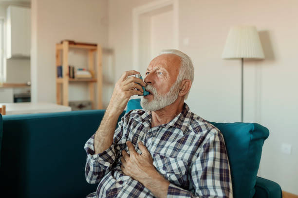 istock Senior Man Inhaling Asthmatic Cure 1188071286