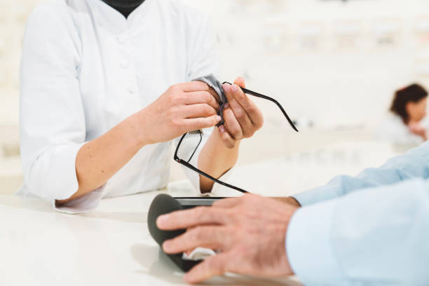 istock Woman hands cleaning glasses for a costumer 1188071478
