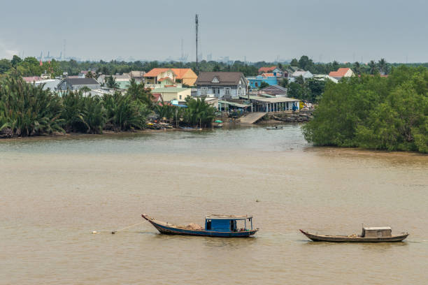 istock 2 sloops anchored on Long Tau River, Phuoc Khanh, Vietnam. 1188074064