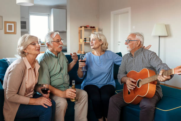 istock Senior Friends Having Party while Playing Guitar 1188074084
