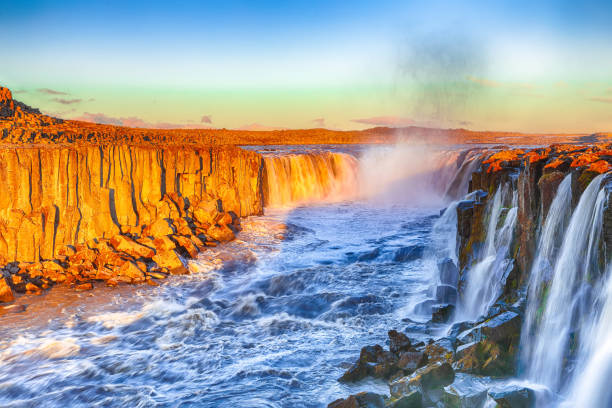istock Dramatic sunset view of fantastic waterfall in Iceland 1188075990