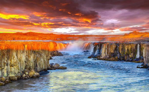 istock Dramatic sunset view of fantastic waterfall in Iceland 1188078992