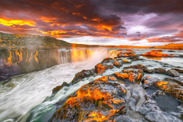 istock Dramatic sunset view  of waterfall in Iceland 1188081287