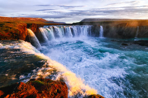 istock Dramatic sunset view  of waterfall in Iceland 1188081291