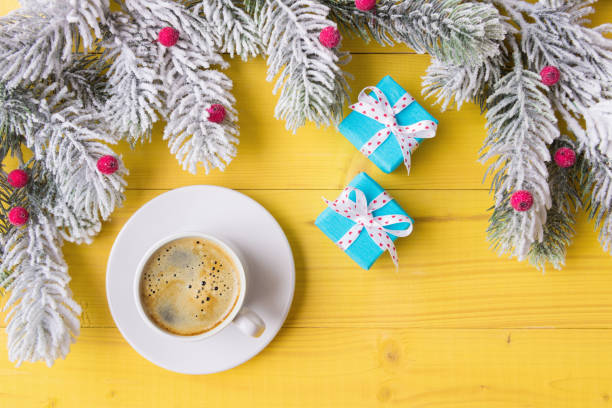 istock Cup of coffee. gift boxes and  frosty Christmas tree branches 1188082466