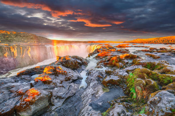 istock Dramatic sunset view  of waterfall in Iceland 1188082565