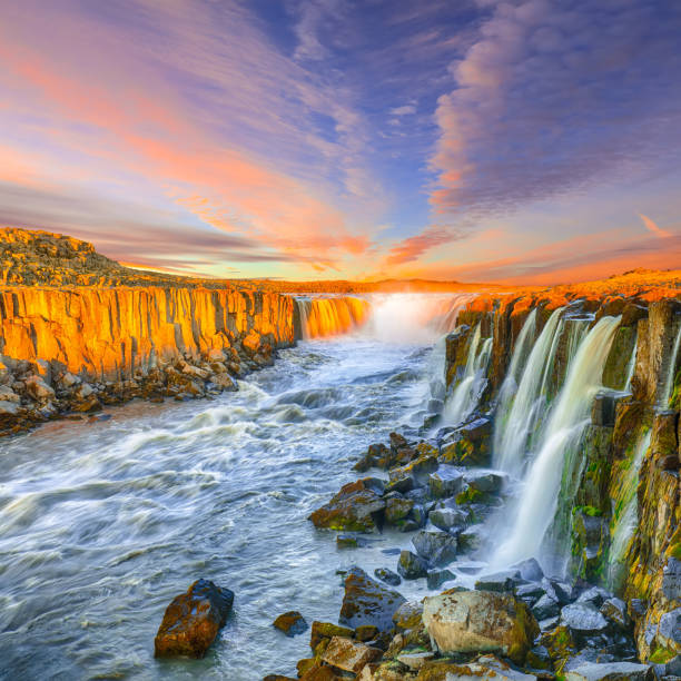 istock Dramatic sunset view of fantastic waterfall in Iceland 1188083779