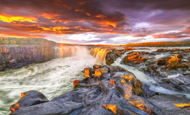 istock Dramatic sunset view  of waterfall in Iceland 1188084469