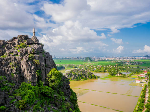 istock Karst formations and rice paddy fields from the lying dragon mountain, Tam Coc, Ninh Binh province, Vietnam 1188084627